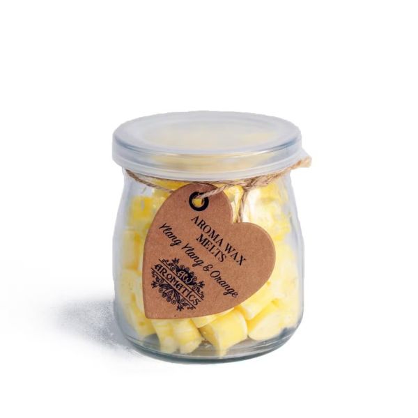 Glass jar of Ylang Ylang & Orange aroma wax melts with silver lid and kraft heart tag, containing 60 soy wax hearts.