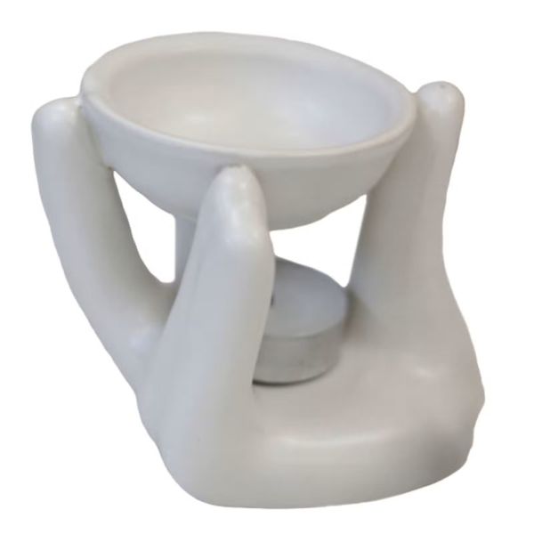 White ceramic oil burner shaped as two hands holding a bowl, designed for wax melts or fragrance oils.