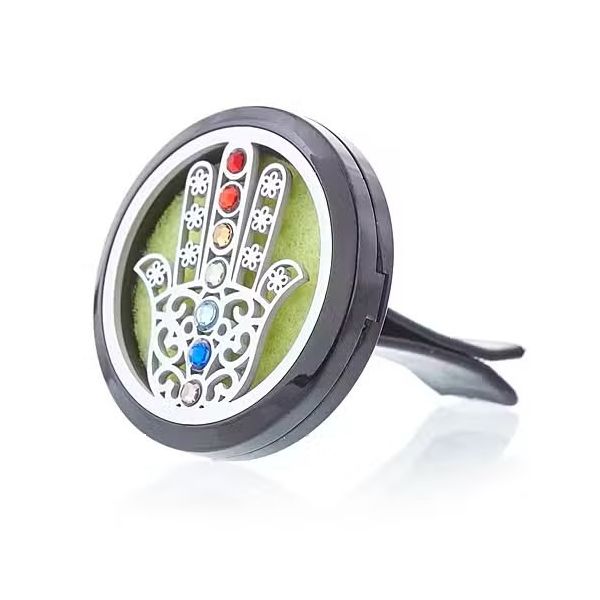 Round stainless steel car diffuser with hamsa design front panel, shown with coloured felt pad inside.