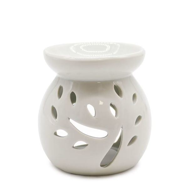 White ceramic oil burner with tree cut-out design, shown from the front.