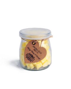 Glass jar of Ylang Ylang & Orange aroma wax melts with silver lid and kraft heart tag, containing 60 soy wax hearts.