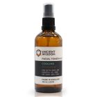 Brown 100ml spray bottle of Witch Hazel with Peppermint Facial Toner Mist, with white label and black nozzle.